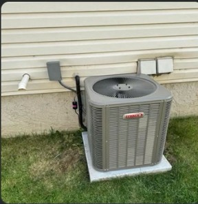 Lennox AC condenser on a concrete pad
